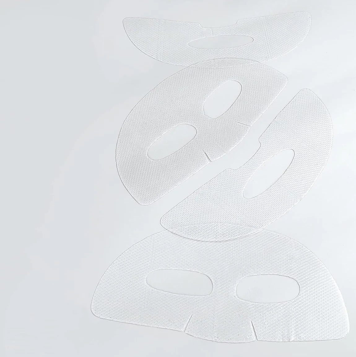 De twee hydrogelvellen van het Mediheal Collagen Nude Gel Mask uitgevouwen op een witte ondergrond
