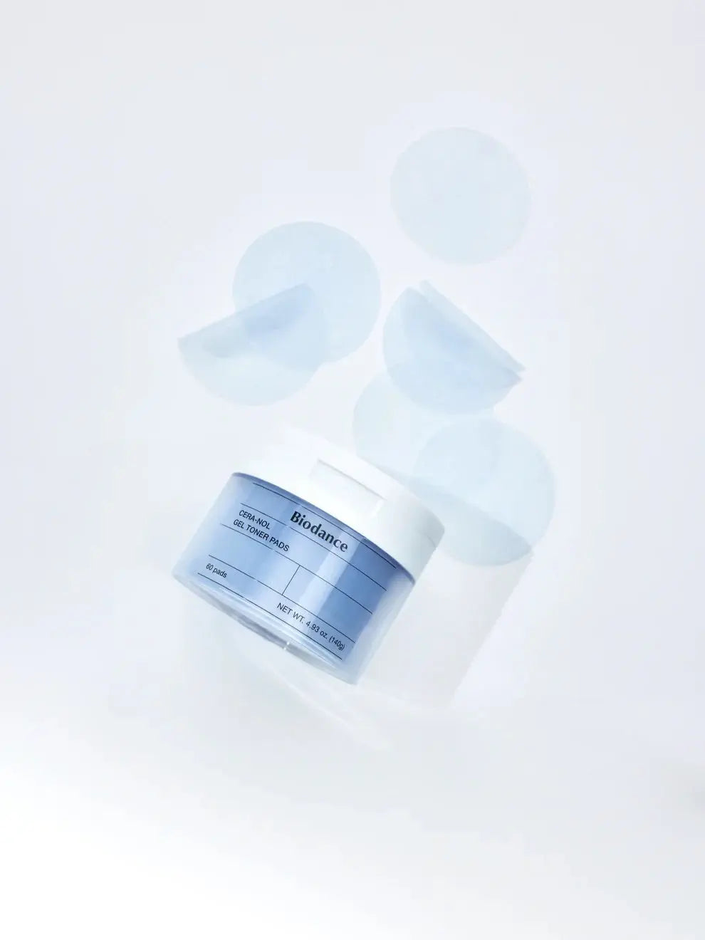 Biodance Cera-nol Gel Toner Pads, pot omringd door zwevende gelpads
