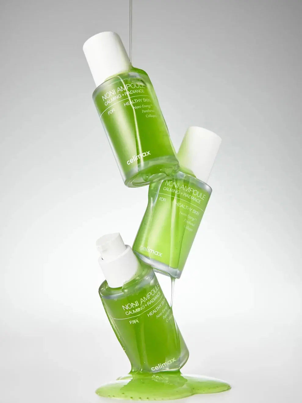 Celimax The Real Noni Energy Ampoule, drie gestapelde flacons met groene ampoule