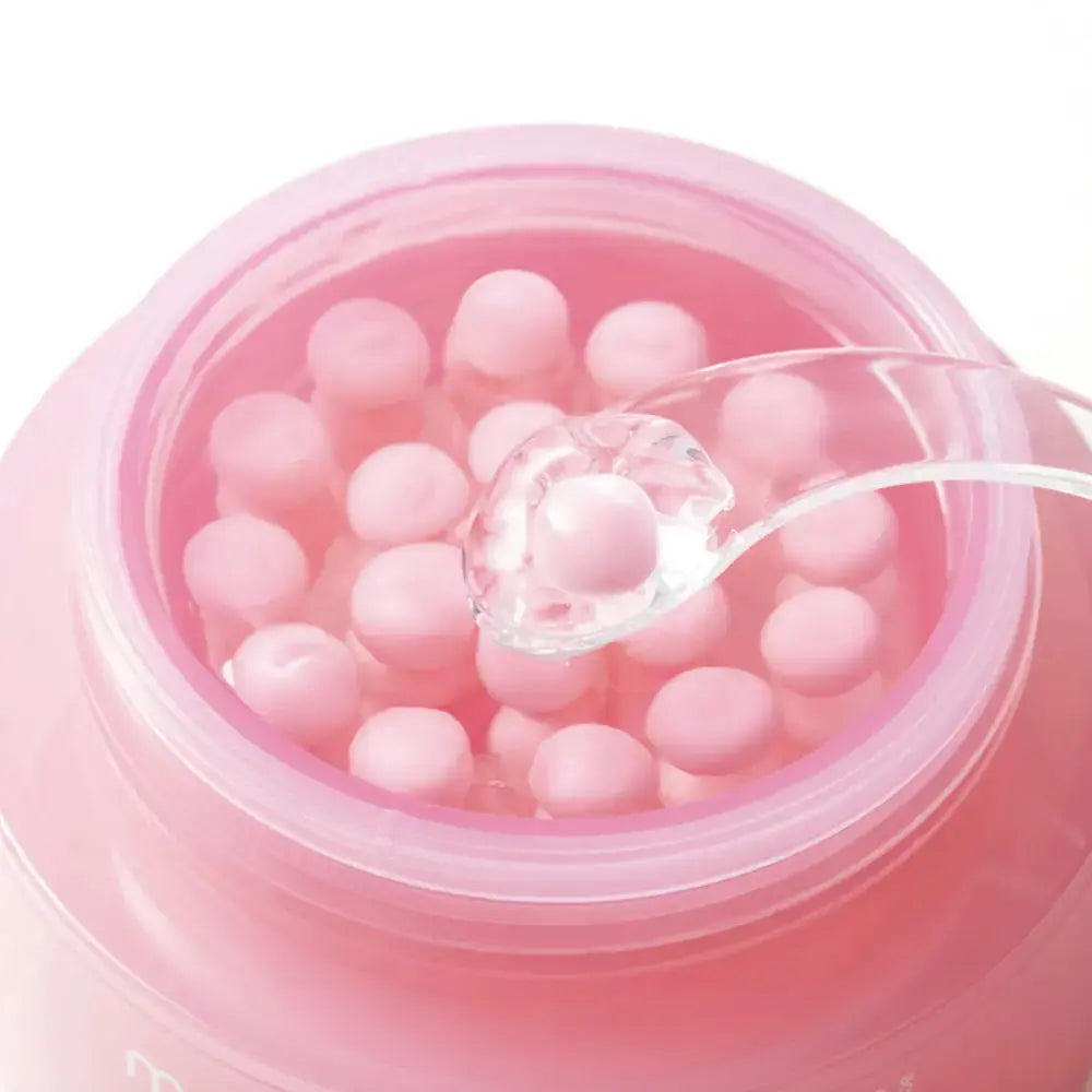 Medicube PDRN Pink Collagen Capsule Cream, close-up van de roze capsules en gel in de pot