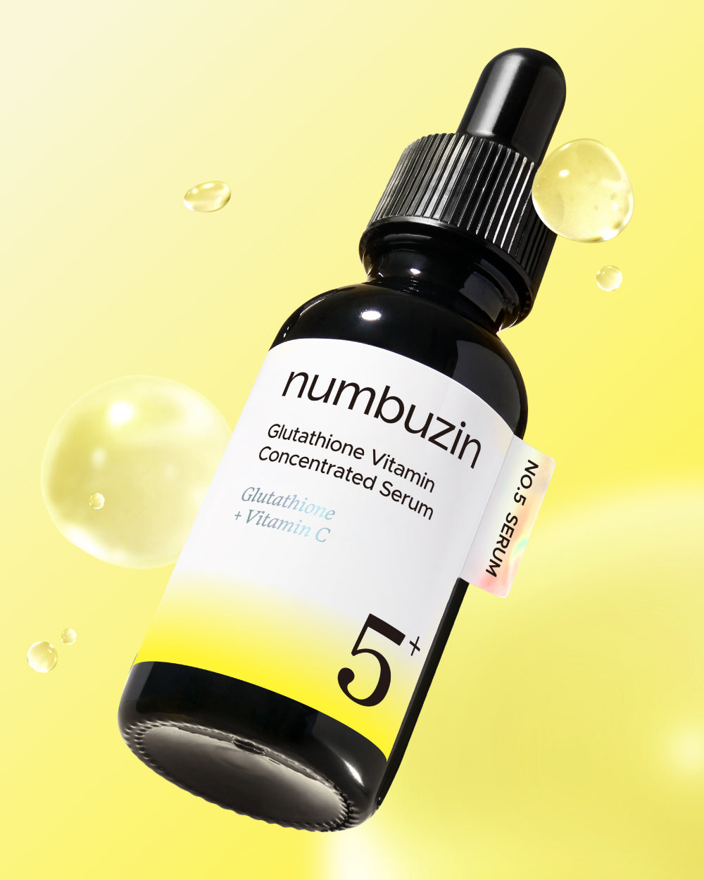 Numbuzin No.5 Vitamin Concentrated Serum, flacon met pipet op een gele achtergrond